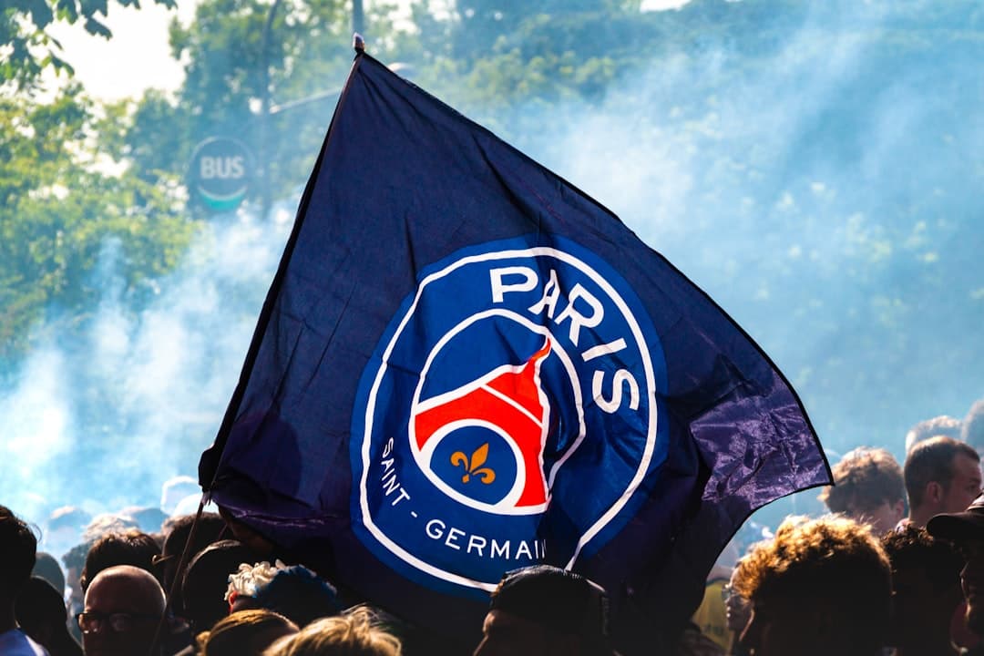 A paris saint-germain flag flies high.